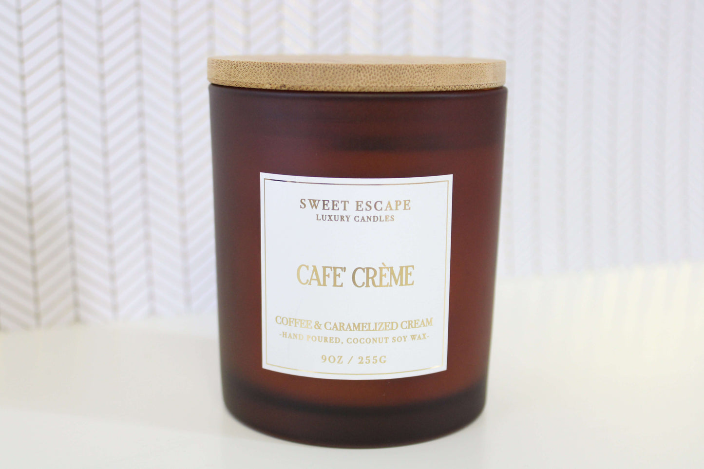 Cafe Creme candle by Sweet Escape Luxury Candles in amber glass with a wooden lid, 9oz hand-poured virgin coconut soy wax, featuring coffee and caramelized cream fragrance notes