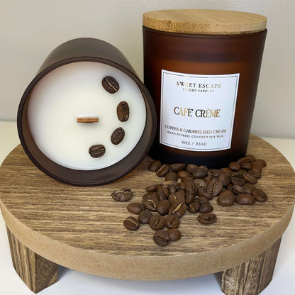 Cafe Creme' hand-poured candle with fresh coffee beans and caramelized cream, 9oz coconut soy wax on wooden stand.