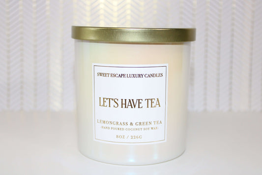 Let's Have Tea Candle by Sweet Escape Luxury Candles, featuring a delicate blend of green tea and lemongrass. This light, refreshing scent combines herbal, citrus, and musky notes to rejuvenate and relax any space, balancing work and restfulness