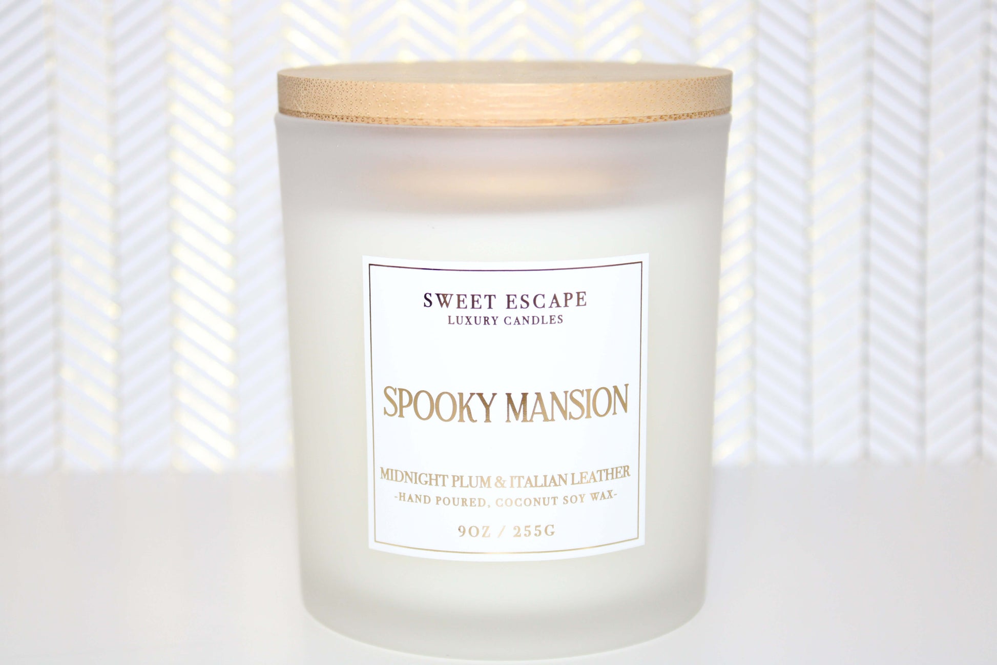 pooky Mansion Candle by Sweet Escape Luxury Candles, featuring a mysterious blend of midnight plum, black violet, and Italian leather. Experience an enchanting fragrance that evokes a realm of dreams and nightmares.